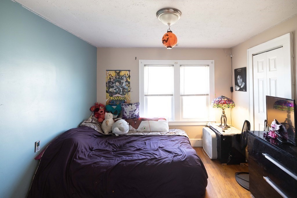 61 Dwight Road Springfield, MA 01108 - Photo 15 of 34 a bedroom with a bed and a large window