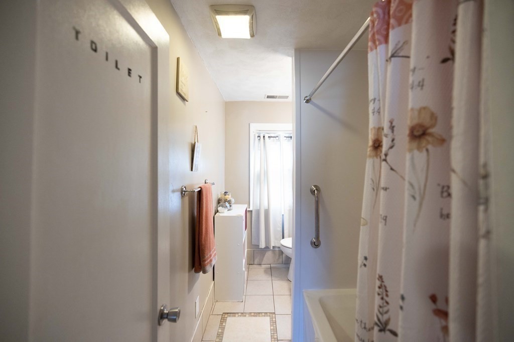 61 Dwight Road Springfield, MA 01108 - Photo 17 of 34 a bathroom with a shower and a tub