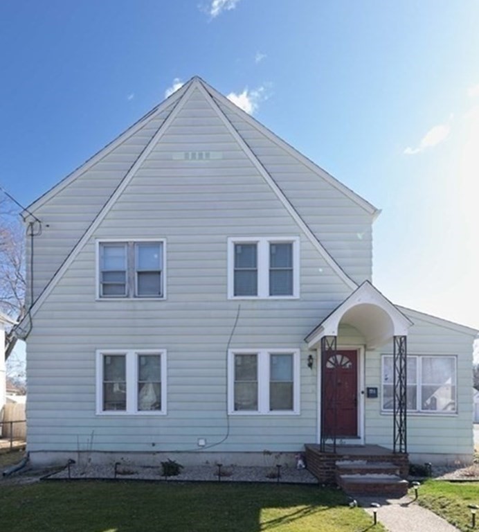 61 Dwight Road Springfield, MA 01108 - Photo 2 of 34 a front view of a house with garden