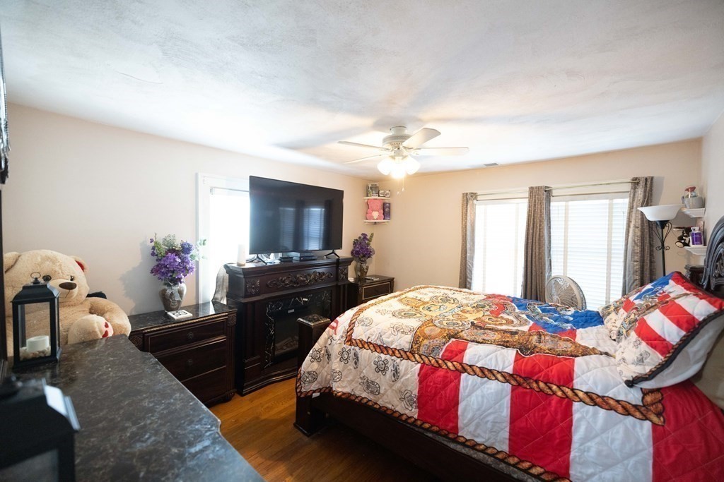 61 Dwight Road Springfield, MA 01108 - Photo 22 of 34 a bedroom with a bed and wooden floor
