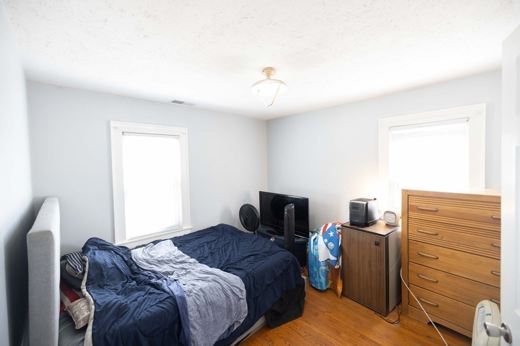 61 Dwight Road Springfield, MA 01108 - Photo 23 of 34 a bedroom with a bed and a tv