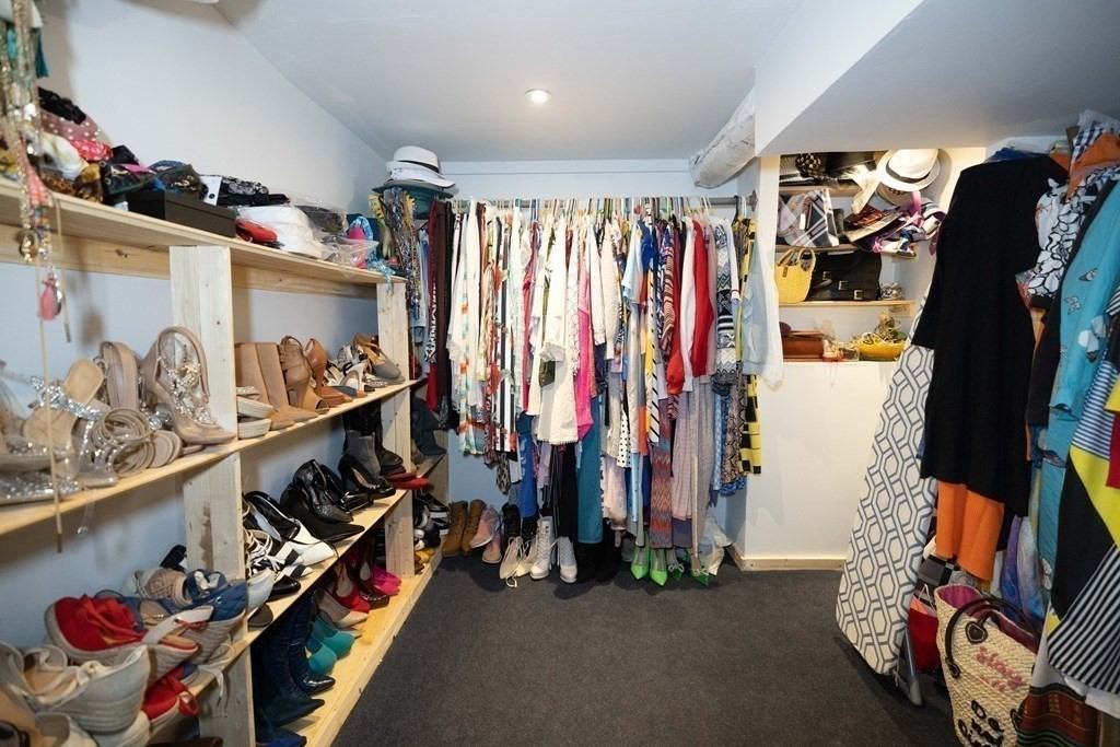 61 Dwight Road Springfield, MA 01108 - Photo 26 of 34 a view of walk in closet with clothes