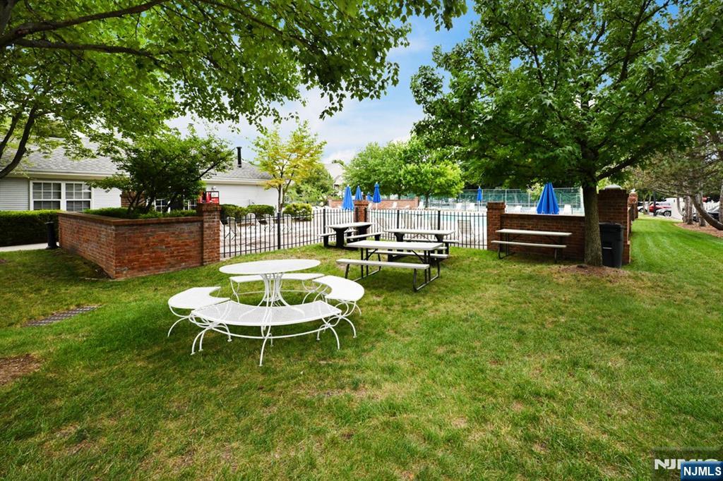 250 Larch Lane Mahwah, NJ 07430 - Photo 24 of 24 a swimming pool with outdoor seating and yard