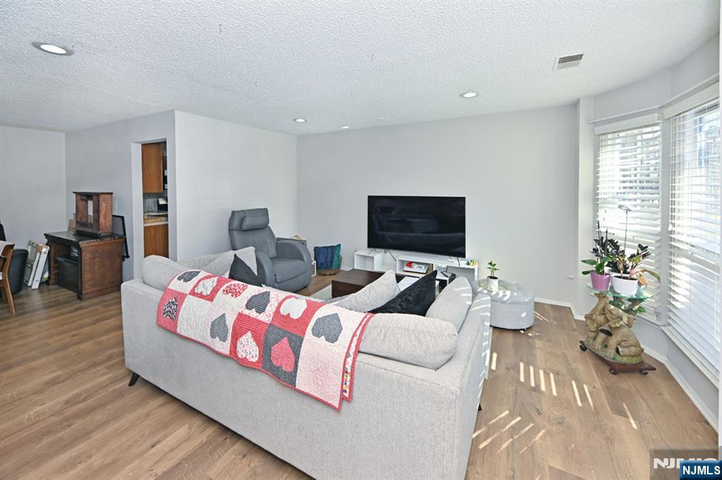 250 Larch Lane Mahwah, NJ 07430 - Photo 7 of 24 a living room with furniture and a flat screen tv
