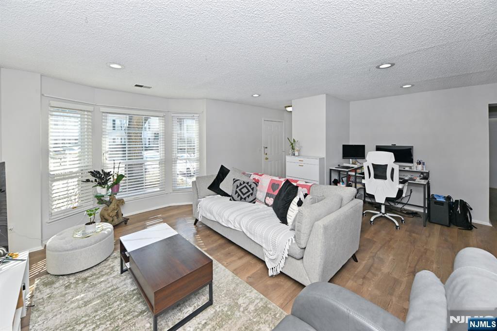 250 Larch Lane Mahwah, NJ 07430 - Photo 8 of 24 a living room with furniture and a large window