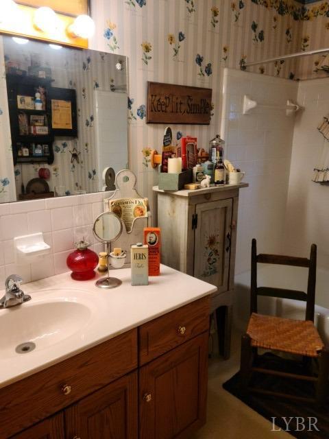 443 Wiggington Road Lynchburg, VA 24501 - Photo 17 of 42 a bathroom with a sink double vanity and a mirror