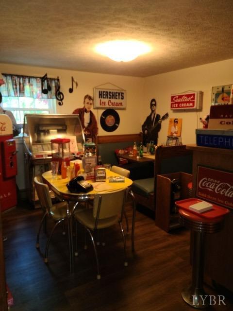 443 Wiggington Road Lynchburg, VA 24501 - Photo 19 of 42 a view of a dining room with furniture and wooden floor