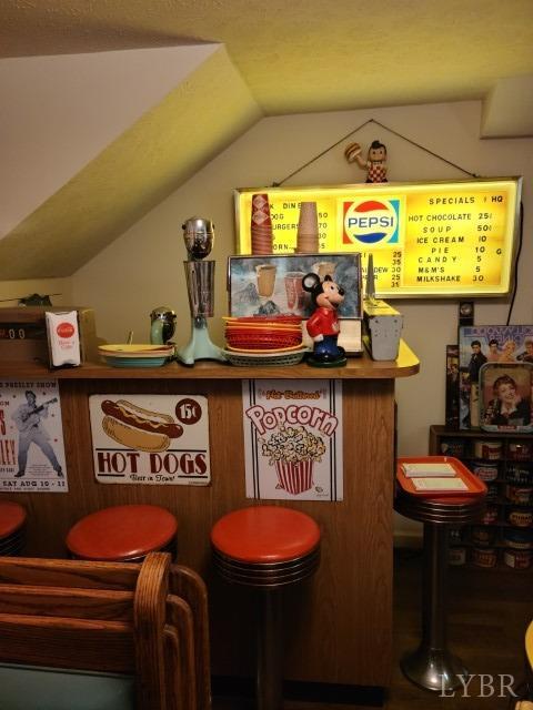 443 Wiggington Road Lynchburg, VA 24501 - Photo 20 of 42 a kitchen with a stove a refrigerator and a dining table