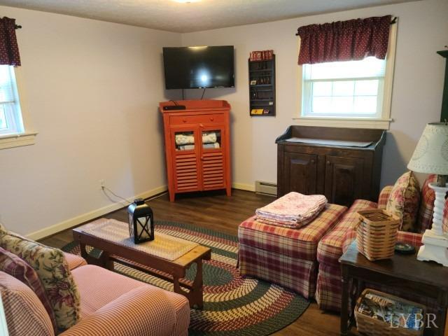 443 Wiggington Road Lynchburg, VA 24501 - Photo 21 of 42 a bedroom with furniture and a flat screen tv