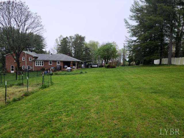 443 Wiggington Road Lynchburg, VA 24501 - Photo 28 of 42 a view of an house with backyard space and swimming pool