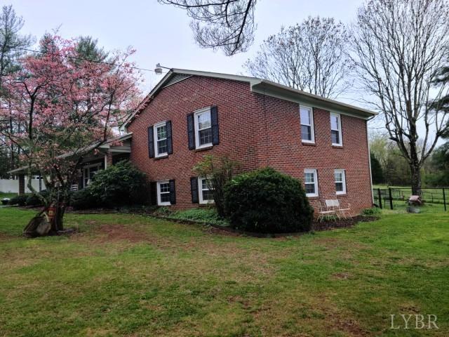 443 Wiggington Road Lynchburg, VA 24501 - Photo 33 of 42 a house that has a tree in front of it