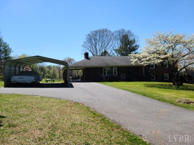 443 Wiggington Road Lynchburg, VA 24501 - Photo 6 of 42 a front view of a house with a yard and garage