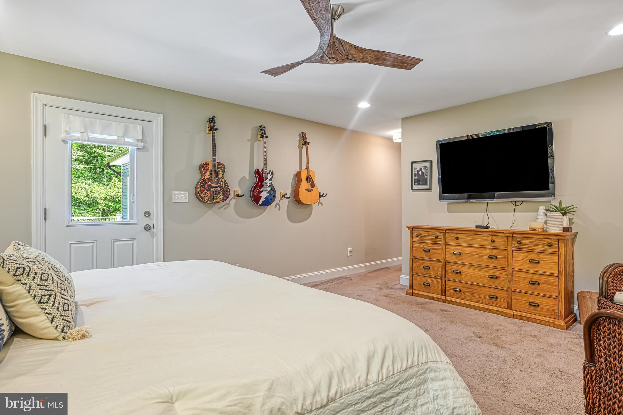 222 Battlefield Road Locust Grove, VA 22508 - Photo 16 of 84 a bedroom with a bed and a flat screen tv