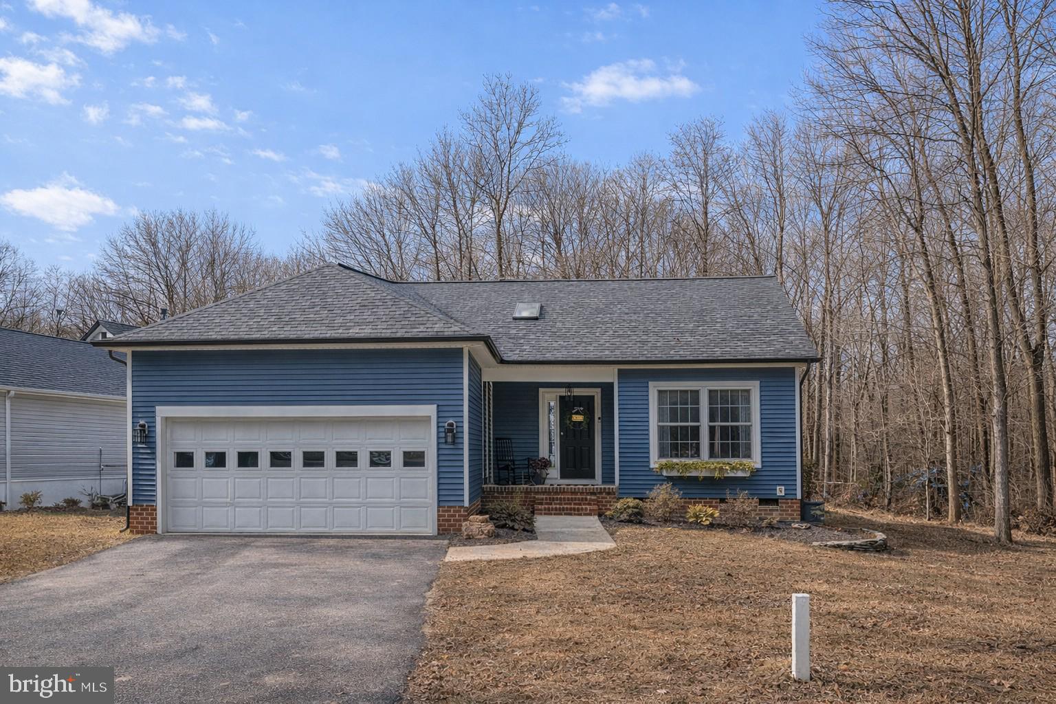 222 Battlefield Road Locust Grove, VA 22508 - Photo 2 of 84 a front view of a house with yard and garage
