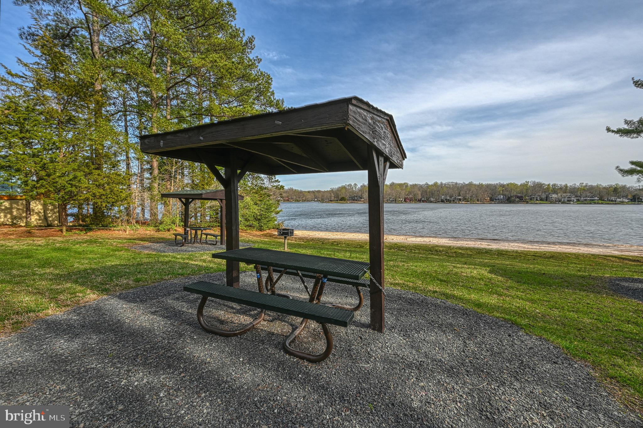 222 Battlefield Road Locust Grove, VA 22508 - Photo 42 of 49 a view of a bench in the garden near a lake