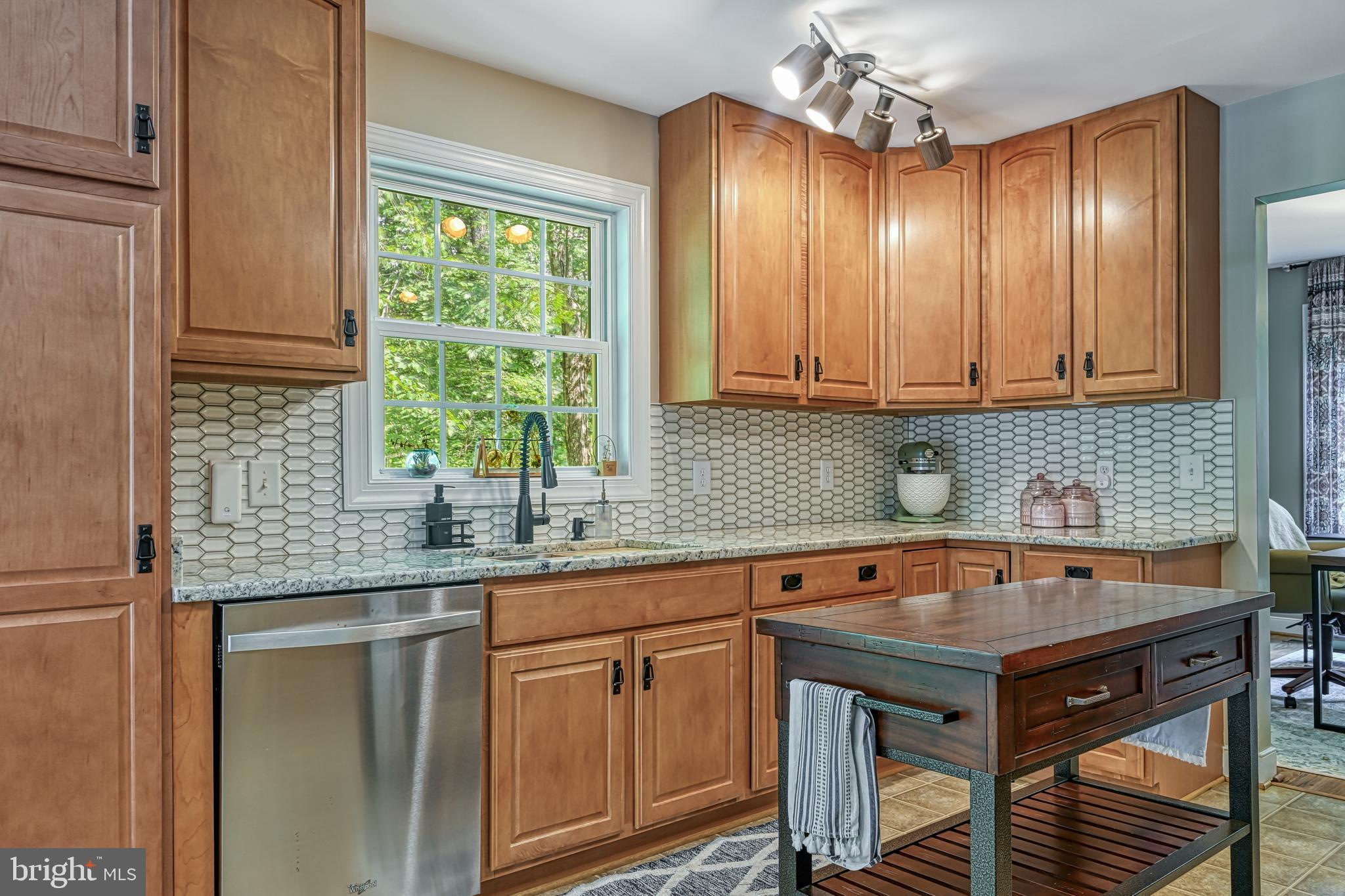 222 Battlefield Road Locust Grove, VA 22508 - Photo 5 of 49 a kitchen with stainless steel appliances granite countertop a sink and cabinets
