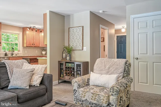 a kitchen with stainless steel appliances a sink a stove and cabinets