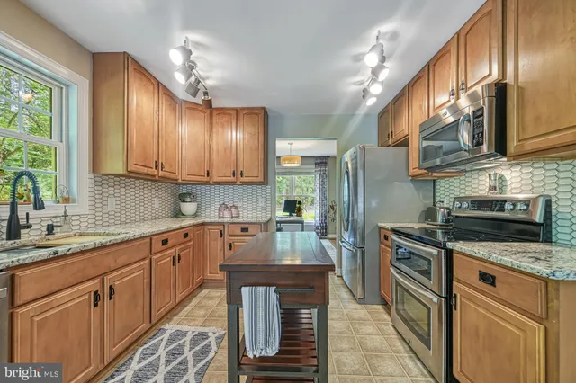 a view of a workspace with furniture and a potted plant