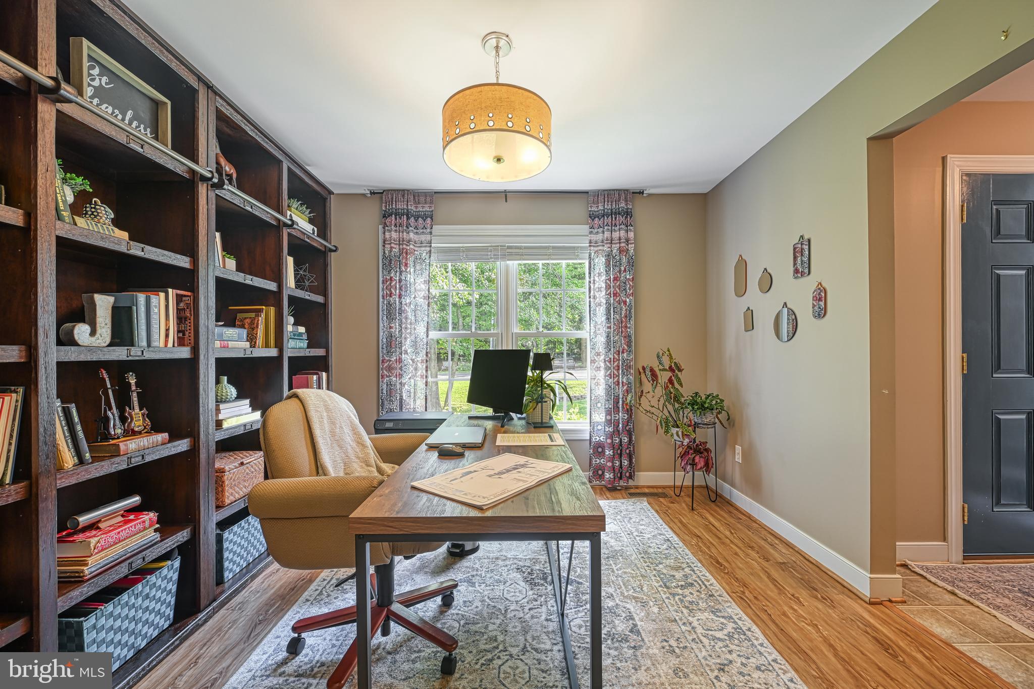 222 Battlefield Road Locust Grove, VA 22508 - Photo 9 of 49 a view of a workspace with furniture and a potted plant