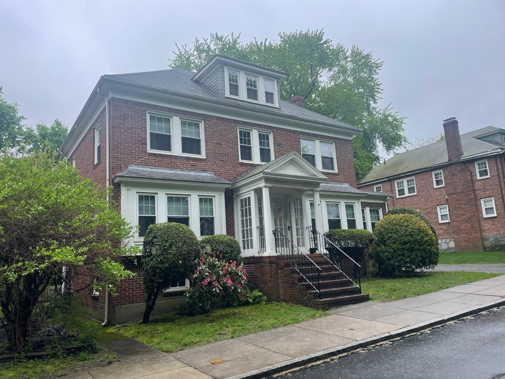 27 Greycliff Road Boston, MA 02135 - Photo 1 of 11 a front view of a house with a garden