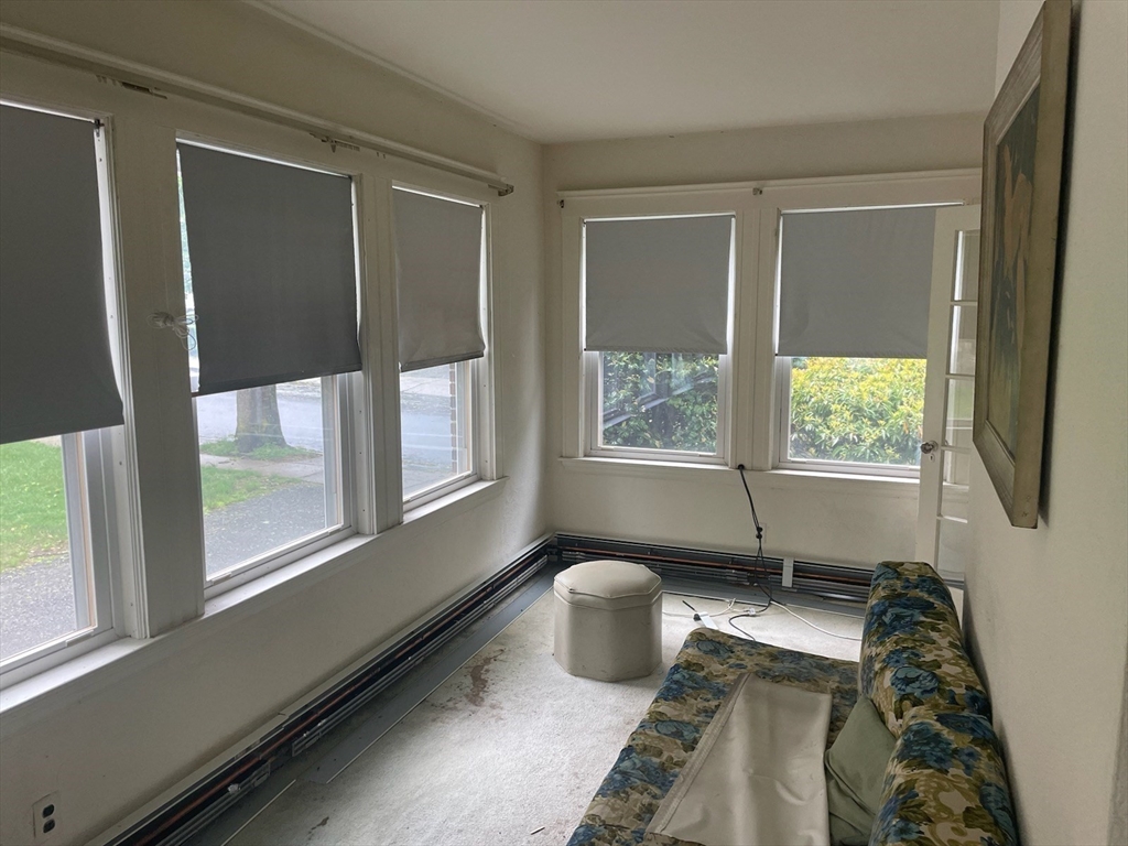 27 Greycliff Road Boston, MA 02135 - Photo 7 of 11 a living room with furniture and a window