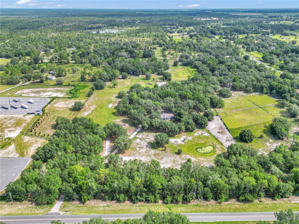 11151 Southeast 30th Street Morriston, FL 32668 - Photo 1 of 1 a view of a yard with an outdoor space and seating area