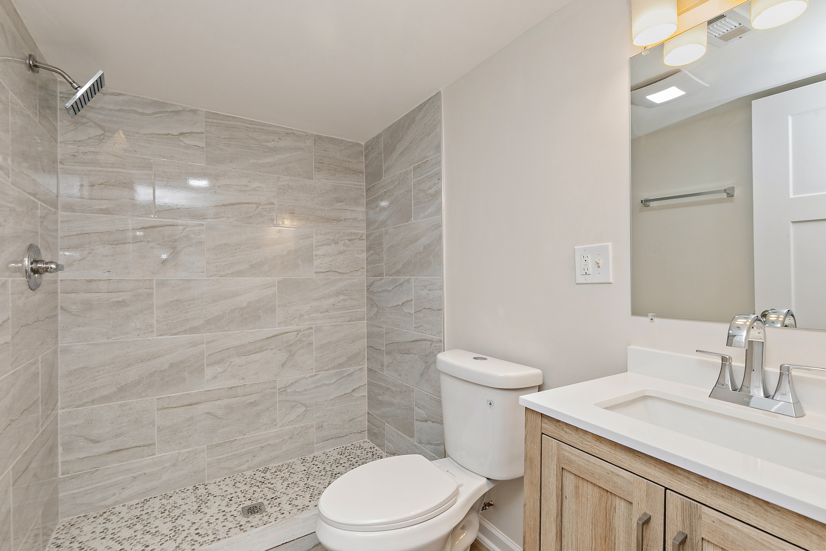 1101 Colony Court Streamwood, IL 60107 - Photo 14 of 16 a bathroom with a sink a toilet and shower