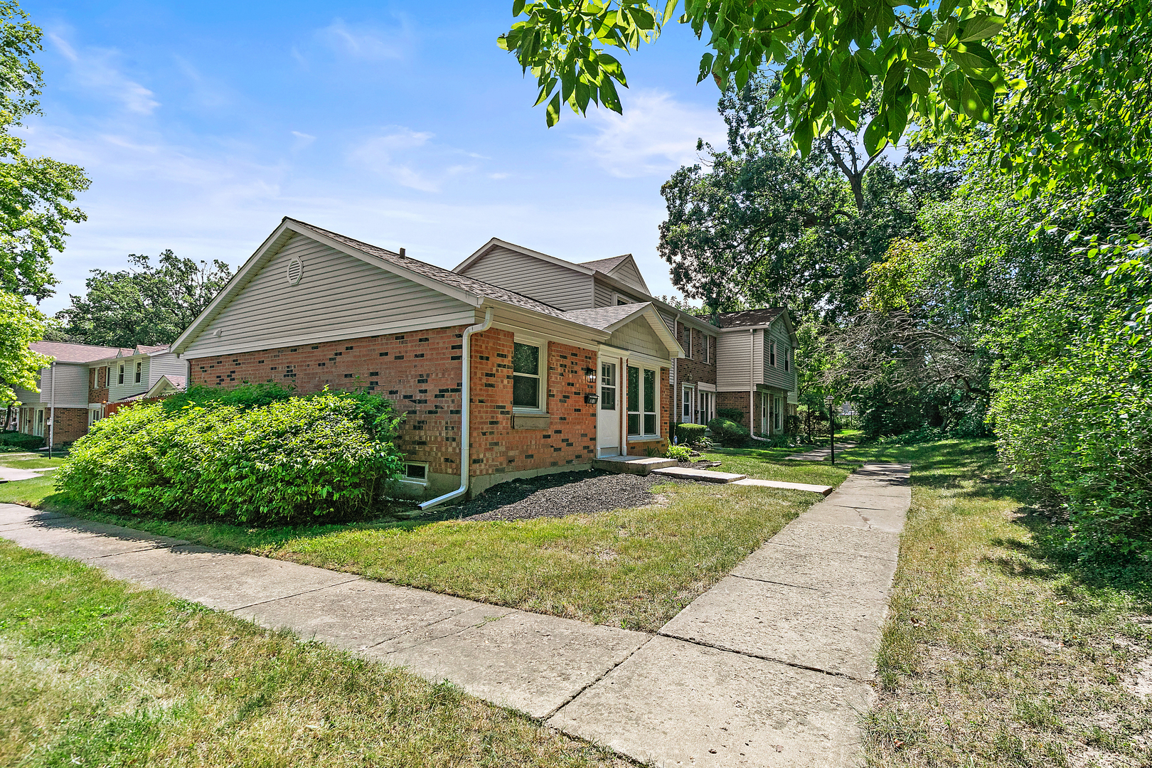 1101 Colony Court Streamwood, IL 60107 - Photo 2 of 16 a front view of a house with a yard