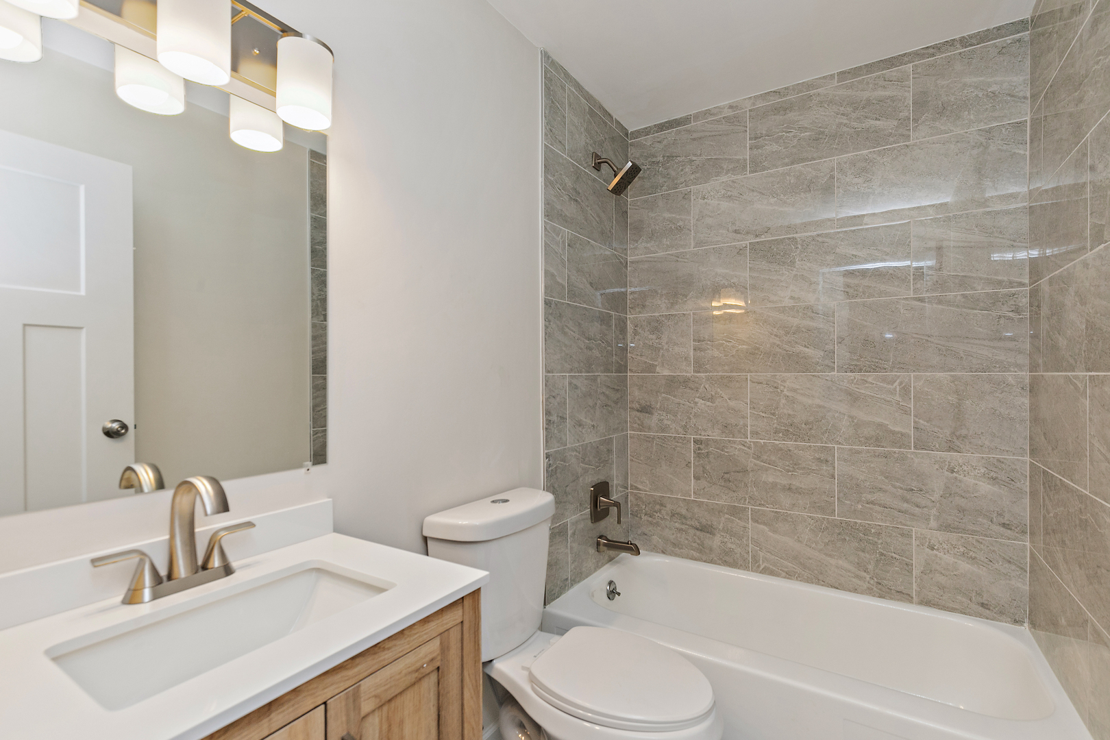 1101 Colony Court Streamwood, IL 60107 - Photo 9 of 16 a bathroom with a sink toilet and shower