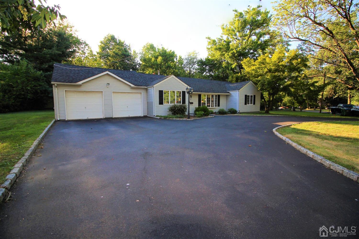 26 Homestead Road Edison, NJ 08820 - Photo 2 of 34 a view of a house with a yard and large trees