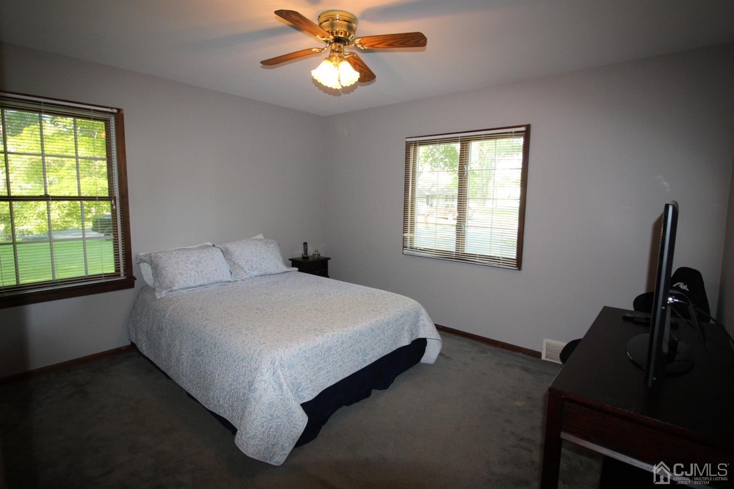 26 Homestead Road Edison, NJ 08820 - Photo 13 of 34 a bed sitting in a bedroom next to a window
