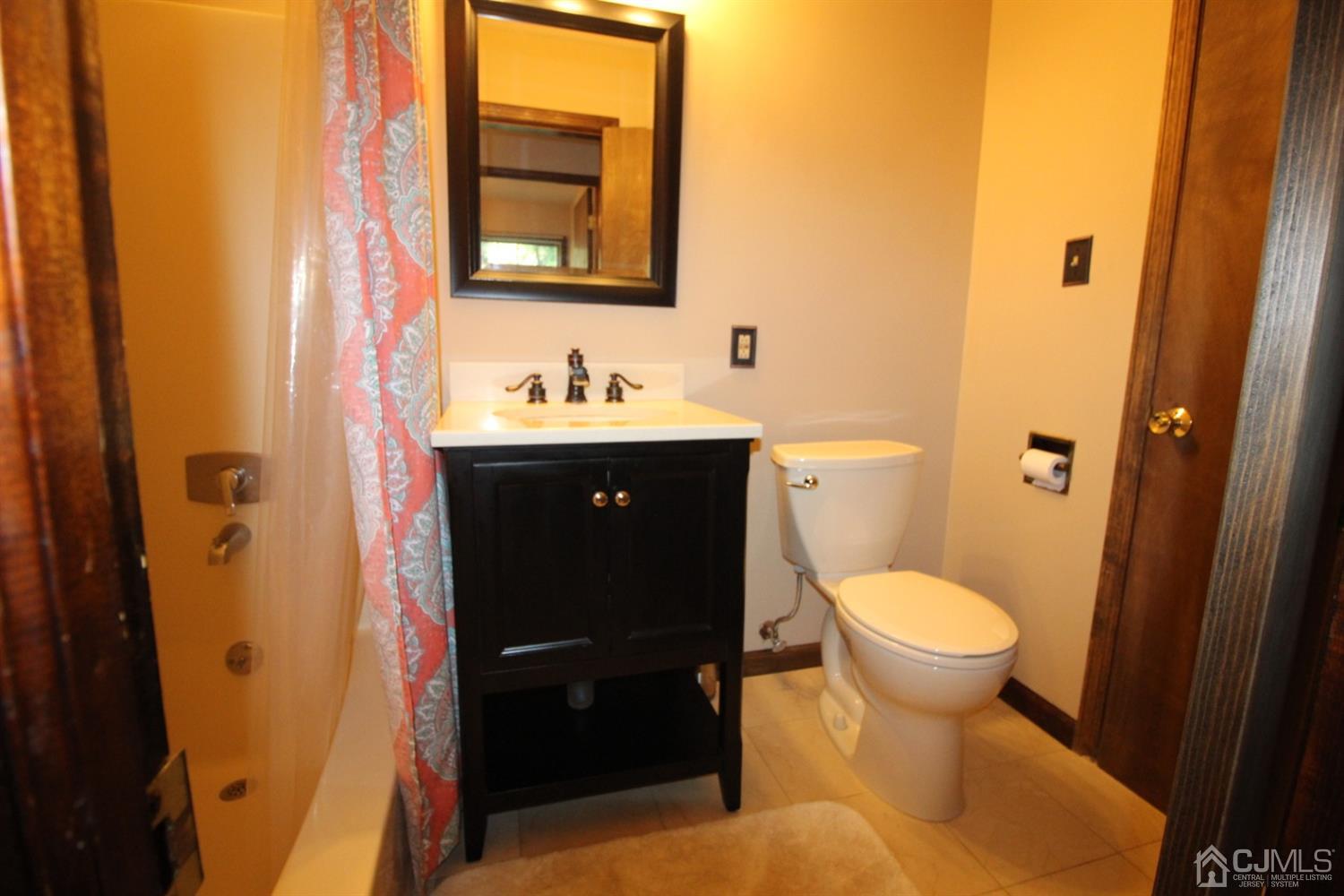 26 Homestead Road Edison, NJ 08820 - Photo 15 of 34 a bathroom with a sink and a toilet