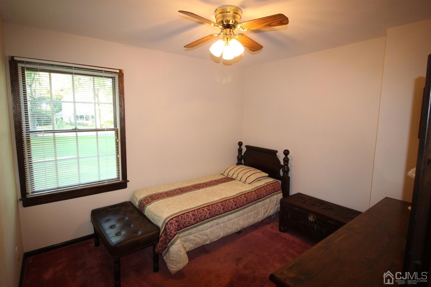 26 Homestead Road Edison, NJ 08820 - Photo 16 of 34 a bedroom with a bed and a window