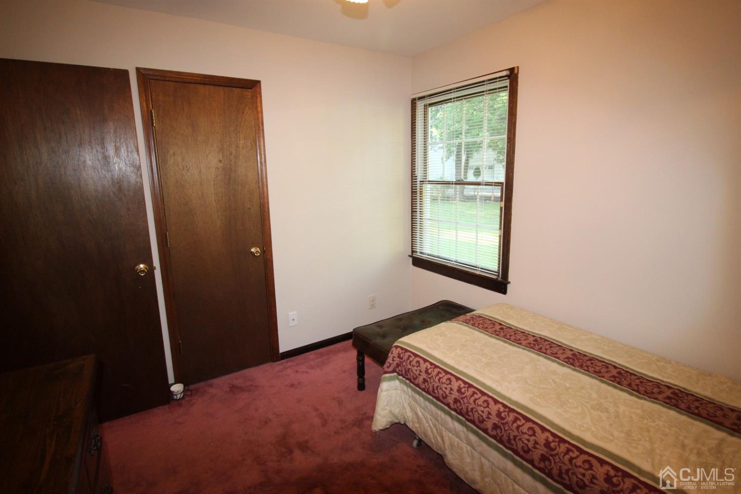 26 Homestead Road Edison, NJ 08820 - Photo 17 of 34 a bedroom with a bed and a window