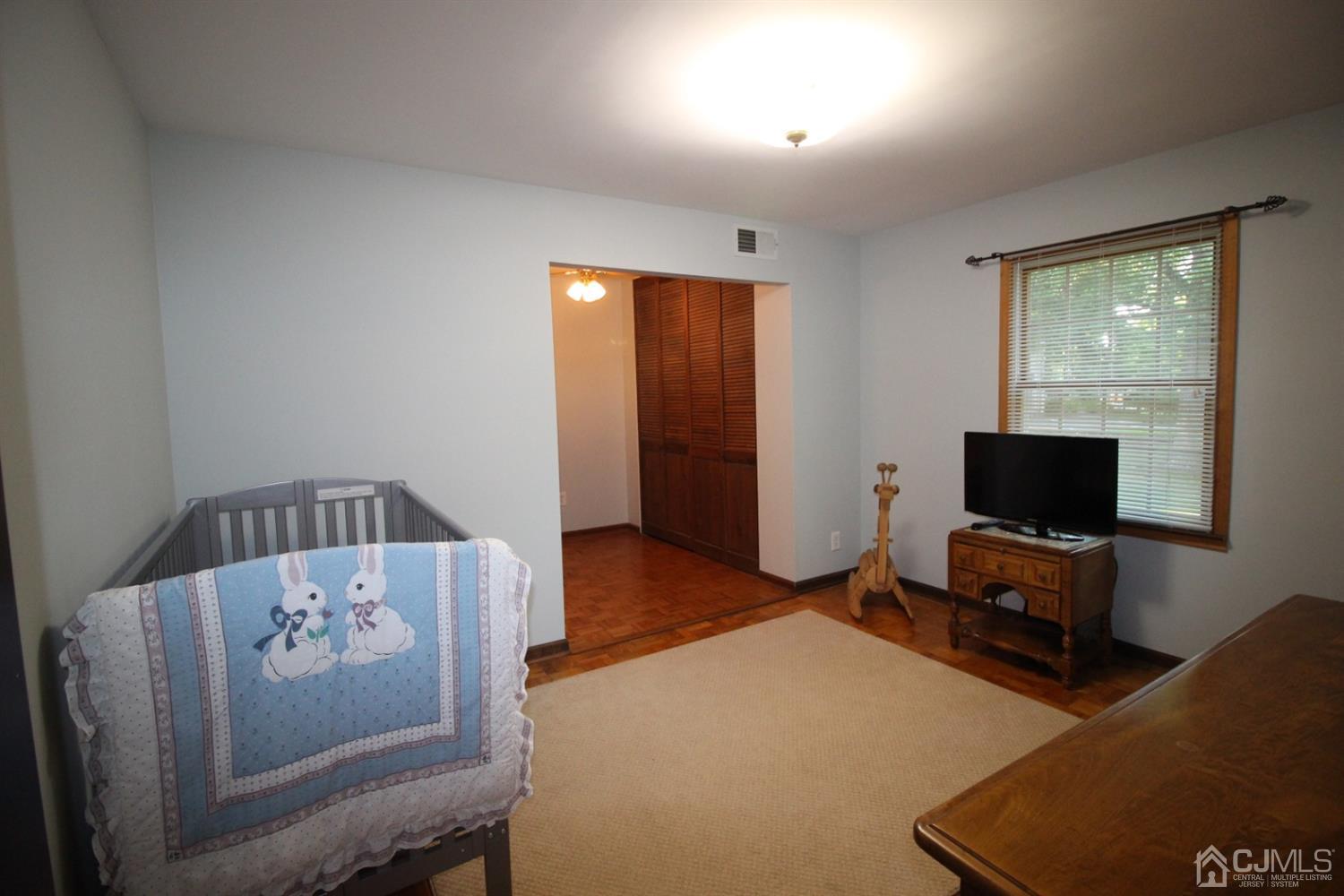 26 Homestead Road Edison, NJ 08820 - Photo 18 of 34 a living room with furniture and a flat screen tv