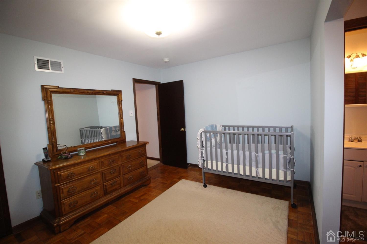 26 Homestead Road Edison, NJ 08820 - Photo 19 of 34 a bedroom with furniture and a window