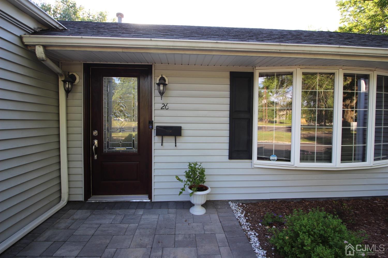 26 Homestead Road Edison, NJ 08820 - Photo 3 of 34 a front view of a house with porch