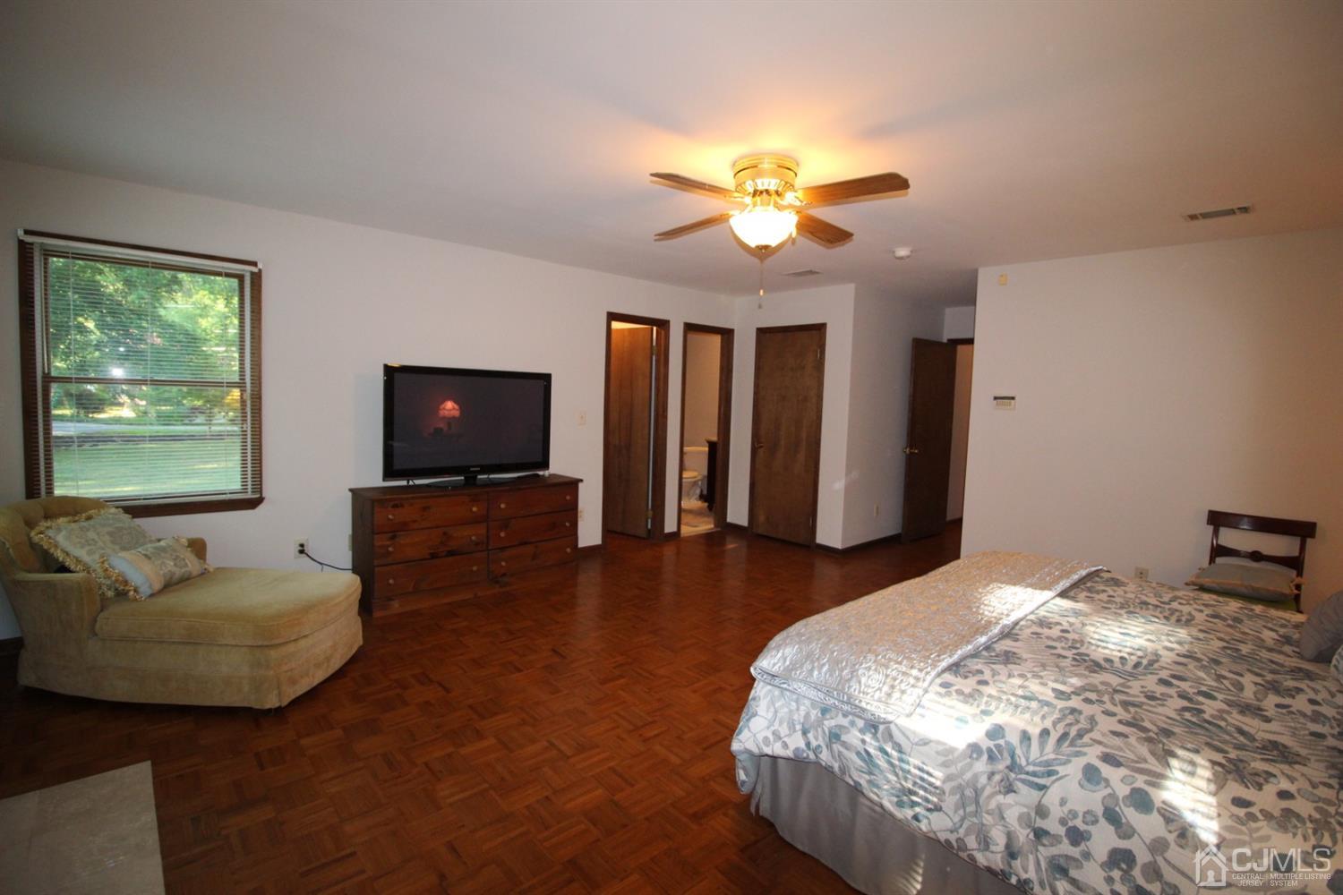 26 Homestead Road Edison, NJ 08820 - Photo 23 of 34 a bedroom with a bed and a couch