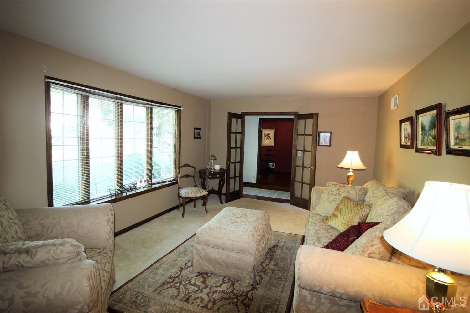 26 Homestead Road Edison, NJ 08820 - Photo 4 of 34 a living room with furniture and a large window