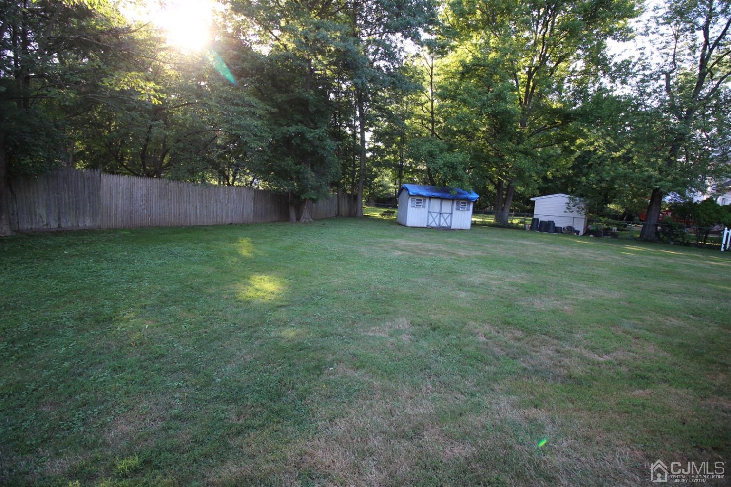 26 Homestead Road Edison, NJ 08820 - Photo 32 of 34 a backyard of a house with lots of green space