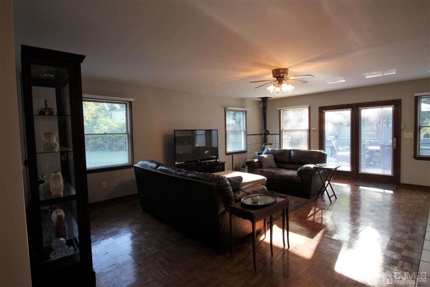 26 Homestead Road Edison, NJ 08820 - Photo 9 of 34 a living room with furniture and a flat screen tv