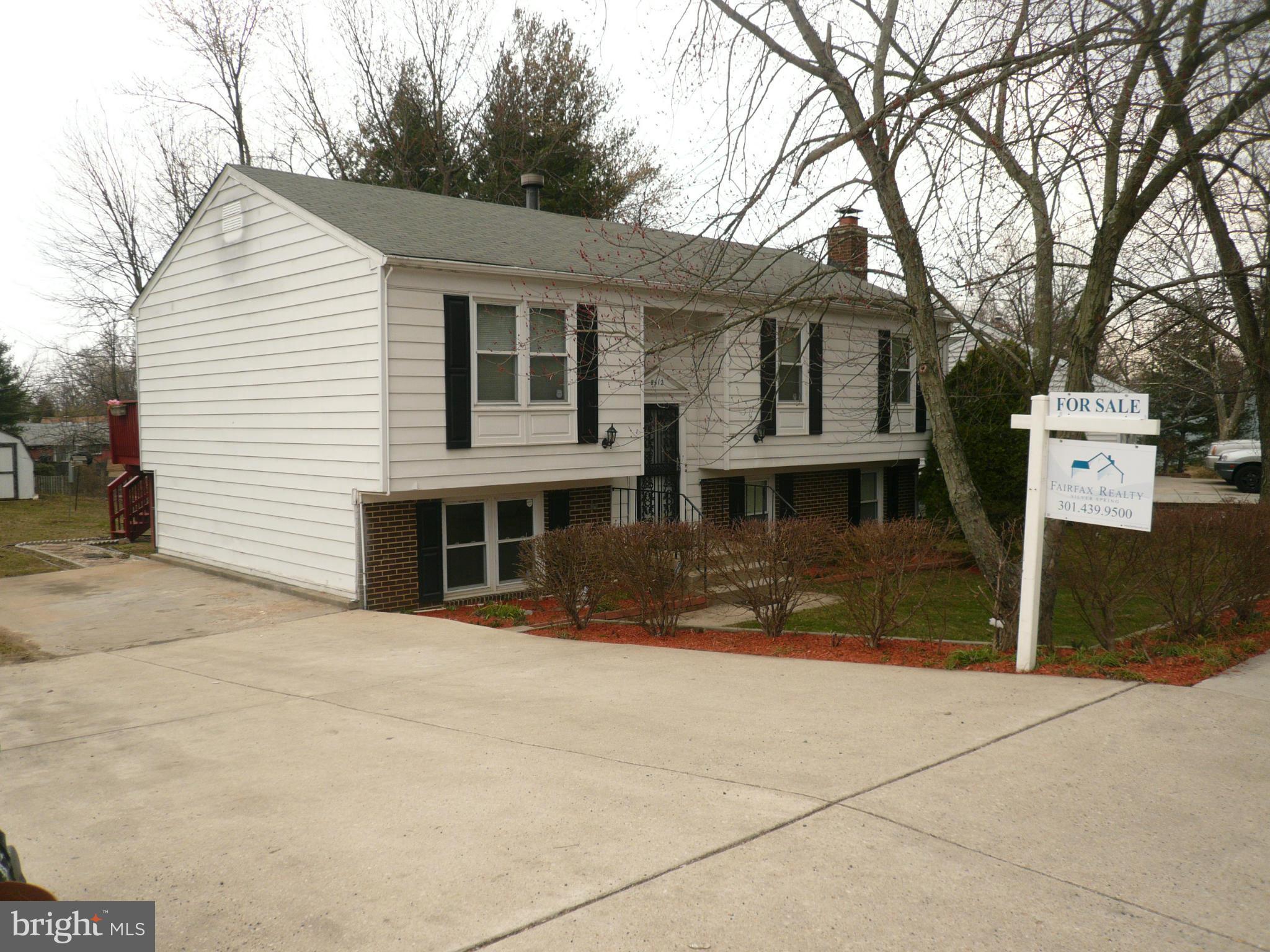 8512 Contee Road Laurel, MD 20708 - Photo 1 of 20 a front view of a house with a yard and garage