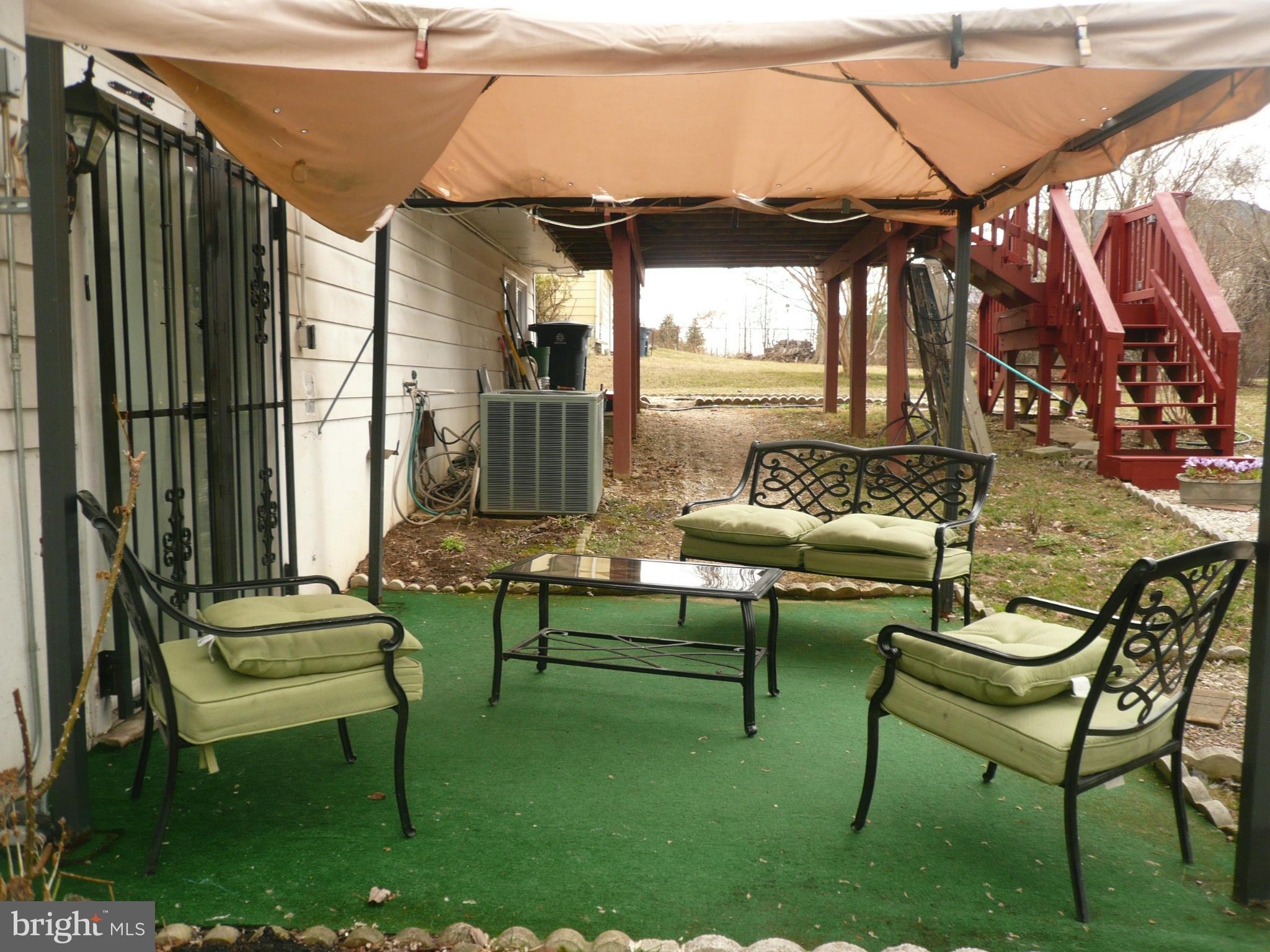 8512 Contee Road Laurel, MD 20708 - Photo 4 of 20 a patio with patio outdoor seating and patio