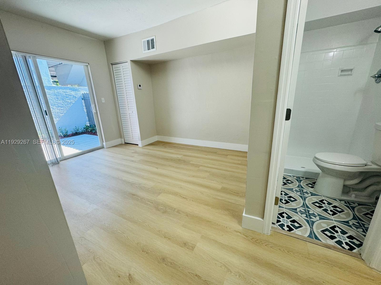 2940 West Flagler Street, Unit 4 Miami, FL 33135 - Photo 5 of 13 a view of a bathroom with a sink and a toilet