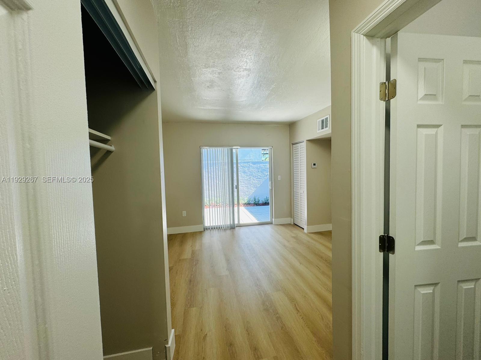 2940 West Flagler Street, Unit 4 Miami, FL 33135 - Photo 6 of 13 a view of empty room with wooden floor