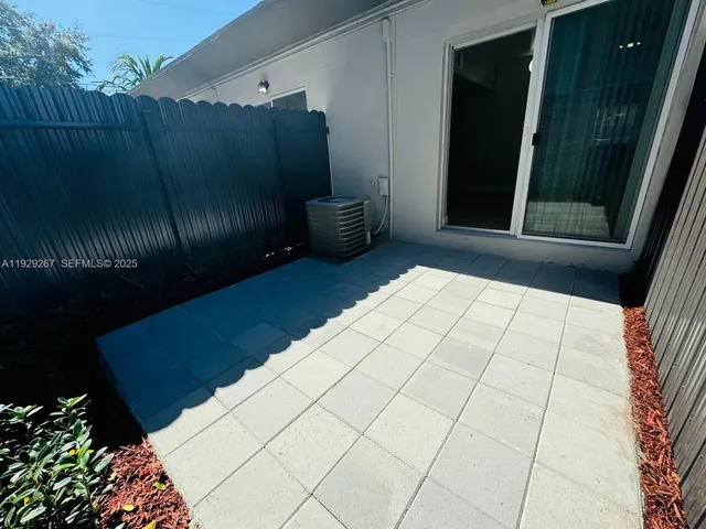 a view of outdoor space with wooden floor