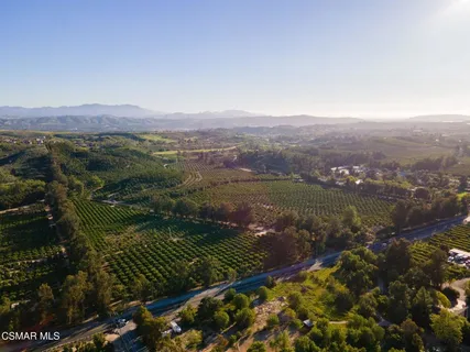 a view of a town with mountains in the background