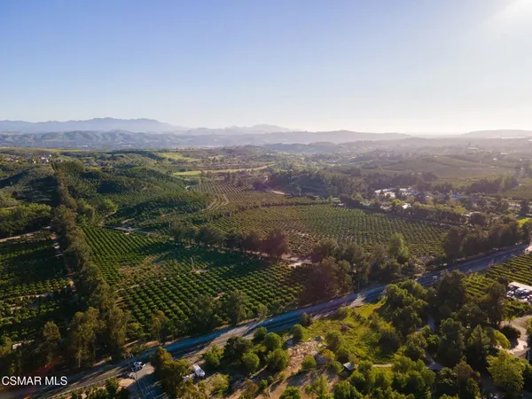 a view of a town with mountains in the background