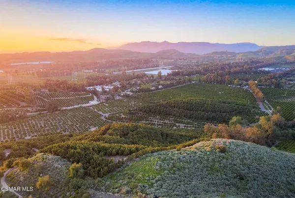 a view of a town with mountains in the background