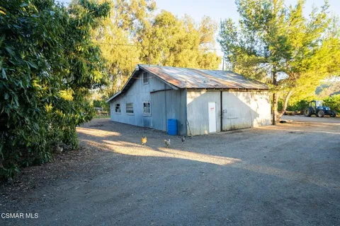 an aerial view of a house with a yard and garden